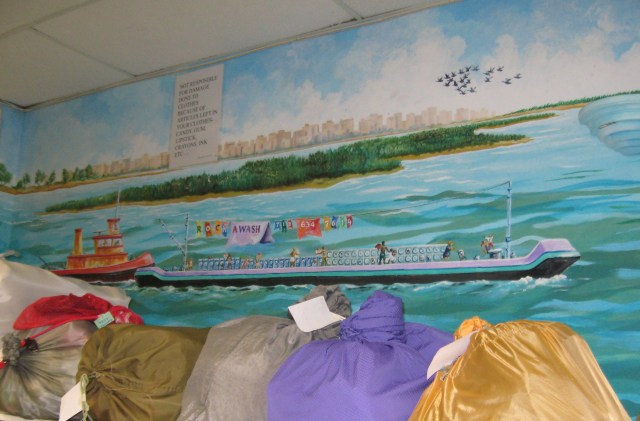 panorama of laundry bags & mural Colorful laundry bags like beach balls on the shore.