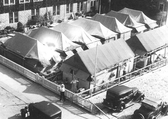Past tents of the Rockaways, at Beach 98 Street and the boardwalk,late 1930's.