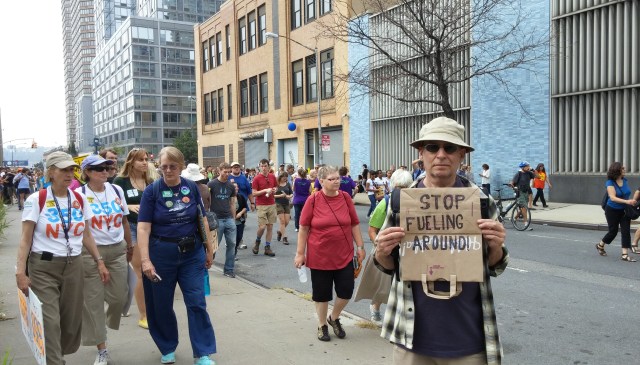 Joe Wachtel, right, displays his creative and eco-friendly message on a re-useable shopping bag. 
